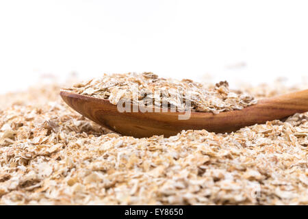 Vollkorn, Hafer Flocken mit Holzlöffel gerollt Stockfoto