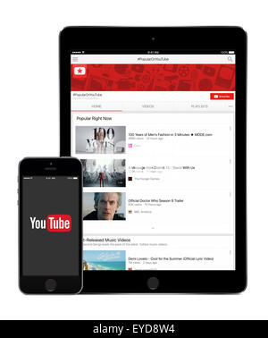 Varna, Bulgarien - 2. Februar 2015: YouTube-Anwendung auf Apple iPad Air 2 Bildschirm und YouTube-app-Logo auf dem Display des iPhone 5 s. Stockfoto