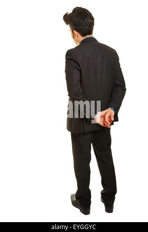 Nachdenklich Geschäftsmann von hinten mit den Händen auf seinem Rücken Stand isoliert auf weißem Hintergrund Stockfoto