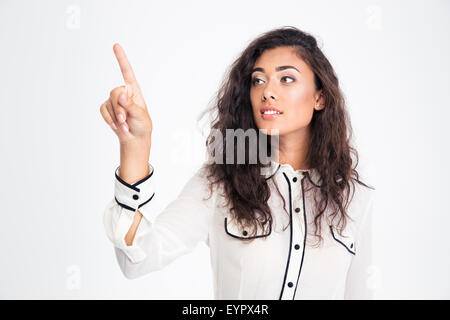 Glückliche junge Geschäftsfrau Zeigefinger entfernt auf einem weißen Hintergrund isoliert Stockfoto