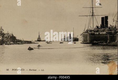 Port Said, Ägypten - 1900 s - eine Postkarte von der Suez-Kanal-Stadt an der Mündung des Suez-Kanals am Mittelmeer, ein Blick auf den Hafen.   COPYRIGHT FOTOSAMMLUNG VON BARRY IVERSON Stockfoto