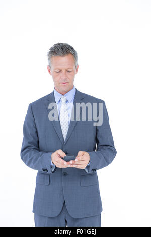 Ein erfolgreicher Geschäftsmann auf Handy Stockfoto