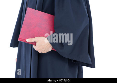 Glücklich schönen Anwalt hält Arbeitsgesetzbuch Stockfoto