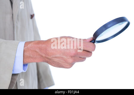 Spion Blick durch die Lupe Stockfoto