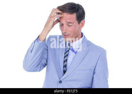 Gestressten Geschäftsmann bekommen Kopfschmerzen Stockfoto