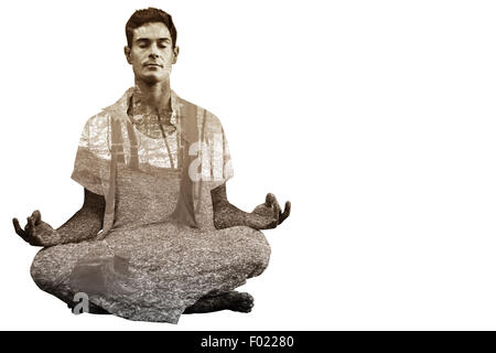 Zusammengesetztes Bild gut aussehender Mann im weißen meditieren im Lotus pose Stockfoto