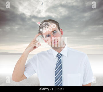 Zusammengesetztes Bild geeky denken mit Finger auf Tempel Geschäftsmannes Stockfoto