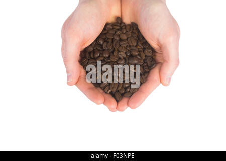 Nahaufnahme der Hände mit Kaffeebohnen Stockfoto