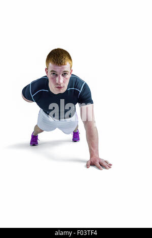Muskuläre Rugby-Spieler eine hand Push-Ups Stockfoto