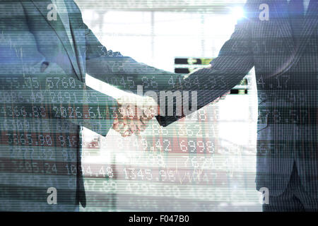 Composite image of handshake in agreement Stockfoto