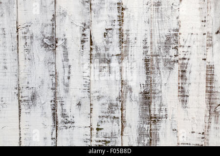 Verwitterte Holz Hintergrund: distressed Farbe auf einem alten Holzzaun Stockfoto