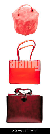 Drei rote Womans Taschen isoliert auf weißem Hintergrund Stockfoto