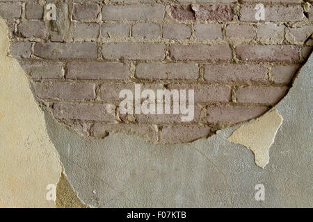 Ziegel und Beton Wand Textur in den Farben gelb und braun. Stockfoto