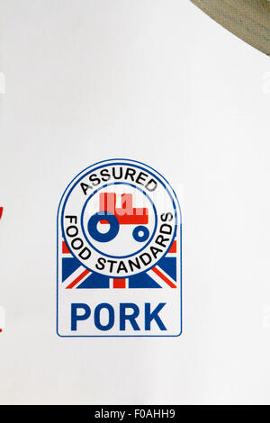 Schweinefleisch versichert Lebensmittelstandards Logo mit kleinen roten Traktor Stockfoto