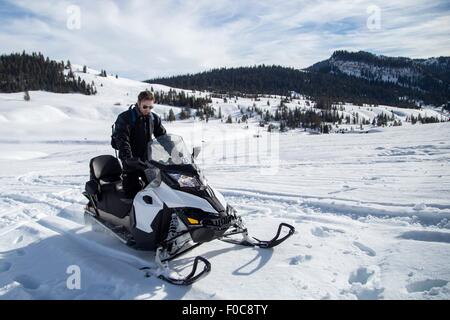 Mann mit Motorschlitten, Jackson Hole, Wyoming Stockfoto