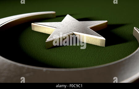 Ein Metall islamischen Halbmond und Stern auf einem strukturierten Hintergrund Stockfoto