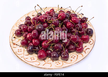 Kirschen auf dem gelben Schild Stockfoto