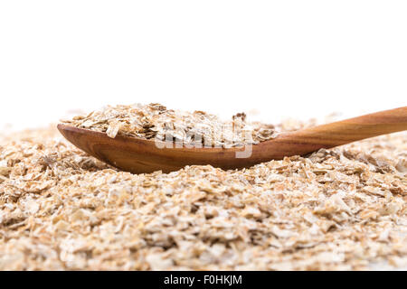 Vollkorn, Hafer Flocken mit Holzlöffel gerollt Stockfoto