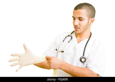 Junger Arzt steril Plastikhandschuhe anziehen Stockfoto