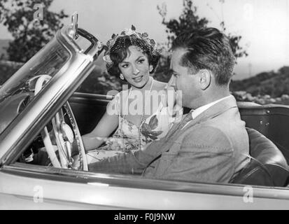 Lollobrigida, Gina, * 4.7.1928, italienische Schauspielerin, halbe Länge, mit Ehemann Mirko Skofic im Auto, ca. 1958, Stockfoto