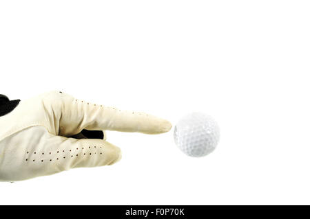 Hand mit Handschuh auf einen Golfball isoliert auf weiss Stockfoto