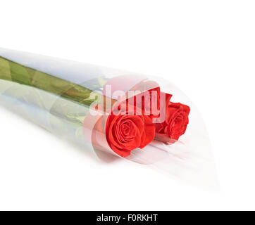 Drei rote Rosen in einer Verpackung Stockfoto