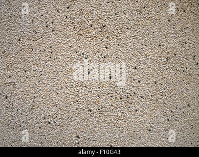 Detail von einer Wand aus grauen und schwarzen Steinchen Stockfoto