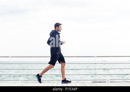 Seite Ansicht Porträt eines Mannes, Sport im freien laufen Stockfoto