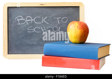 zurück zur Schule auf Tafel mit Büchern und Apple geschrieben Stockfoto
