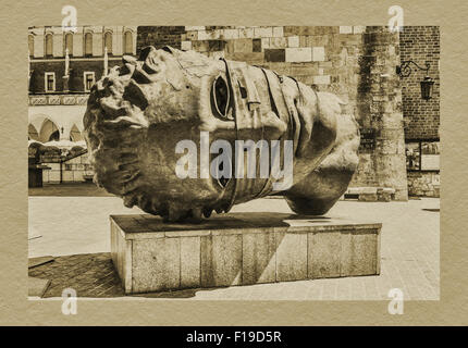 Bronze-Skulptur The Head. Die offizielle Bezeichnung lautet Eros Bendato (Eros gebunden), befindet sich auf dem Marktplatz in Krakau, Polen, Europa Stockfoto