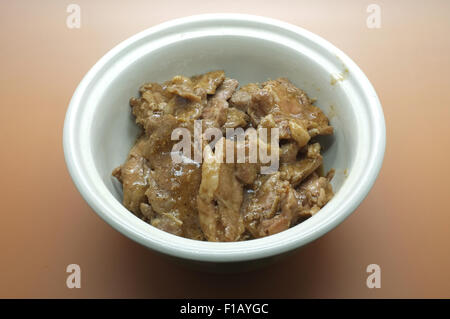 Gebratenes Schweinefleisch mit Knoblauch und Pfeffer verrühren Stockfoto