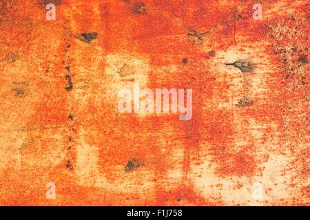 Rusty Orange Metallwand abstrakte Hintergrundfoto. Stockfoto