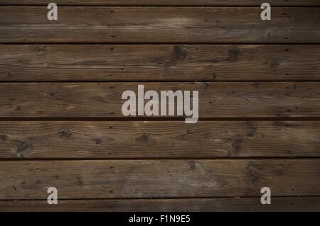 Aufgearbeiteten Holz dunkel. Horizontale alte verwitterte Planken. Stockfoto