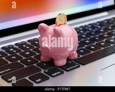 Rosa Sparschwein mit goldenen Medaille auf der Computertastatur. Online-Banking-Konzept Stockfoto