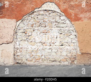 Alte Wand eingemauerten Bogen Laufe, Foto Hintergrundtextur Stockfoto