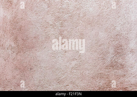 Alte Vintage verputzt Stuck Wand Textur abstrakten Hintergrund in blass rosa Farbe gebürstet Stockfoto