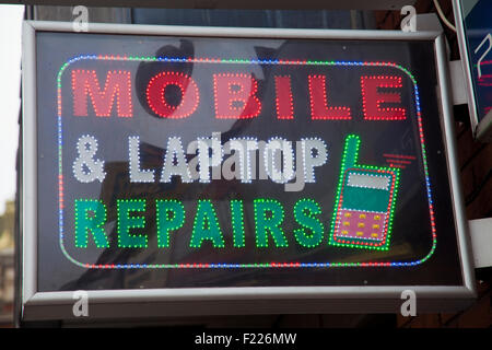 Handy, Laptop Reparaturen Led Zeichen Stockfoto