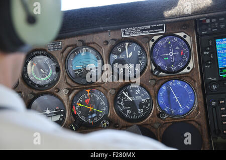 Pilot checks the instrument panel of a light aircraft Stockfoto