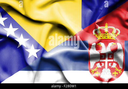 Wehende Flagge von Serbien und Bosnien und Herzegowina Stockfoto