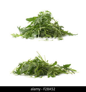 Haufen von entnimmt Sativa Rucola Rucola frische grüne Rucola Blätter, Zusammensetzung isoliert über dem weißen Hintergrund, legen Sie zwei Stockfoto