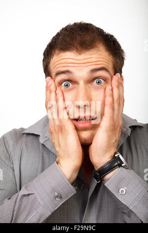 Porträt von erstaunt, überrascht oder Angst junger Mann Stockfoto