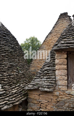 'du Breuil' Hütten in der Nähe von Sarlat (Frankreich). Diese ungeheuerer Steinhütten sind alte landwirtschaftliche Anlagen. Les Cabanes du Breuil. Stockfoto