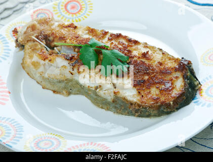 Südafrikanische Fisch - Pfanne gebraten Knoblauch Kingklip Stockfoto