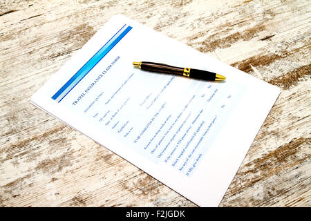 Füllen einen Versicherungsantrag Reisen vor dem Treffen mit des Arztes Stockfoto