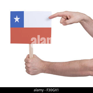 Hand, die kleine Karte, isoliert auf weiss - Flagge von Chile Stockfoto