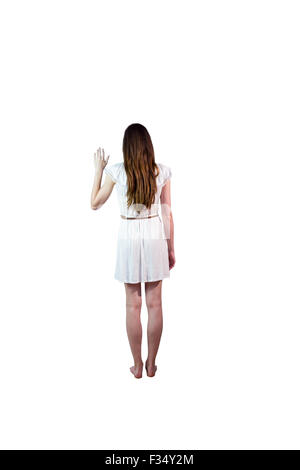 Mädchen im weißen Kleid winken Stockfoto