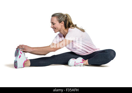 Sportliche Frau in weißem Hintergrund Stockfoto