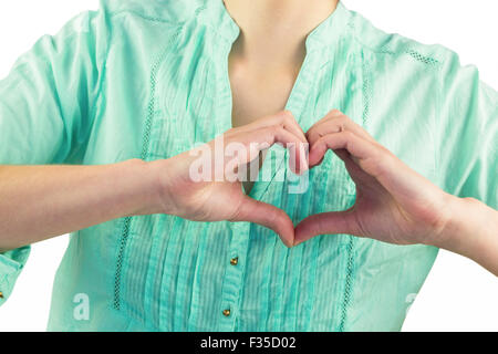 Innenfeldes Frau Herzform Finger machen Stockfoto