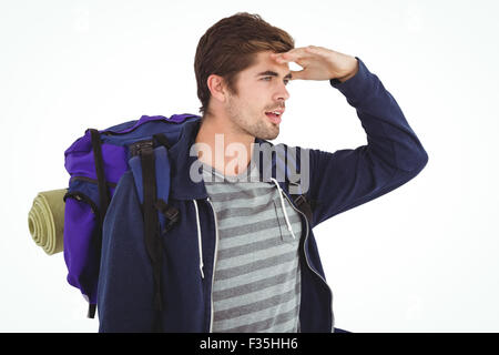 Mann mit Rucksack Abschirmung Augen Stockfoto