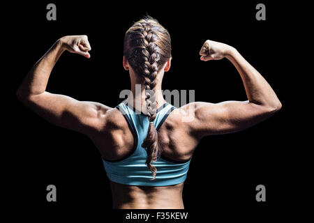 Rückansicht des Frau mit geflochtenen Haaren, Muskeln Stockfoto